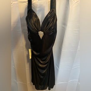 Small black dress never worn still has tags